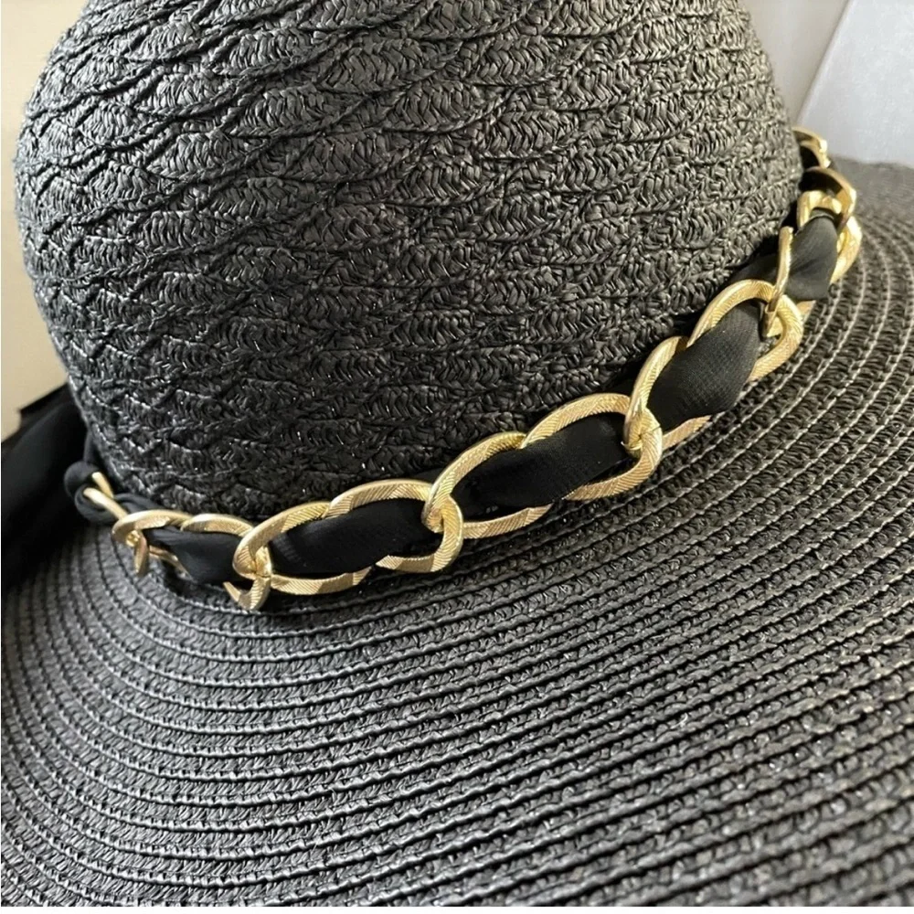 Marcus Adler New York black floppy hat with gold chain and sheer scarf accent